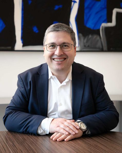 Antoine Rodriguez sitting at his desk